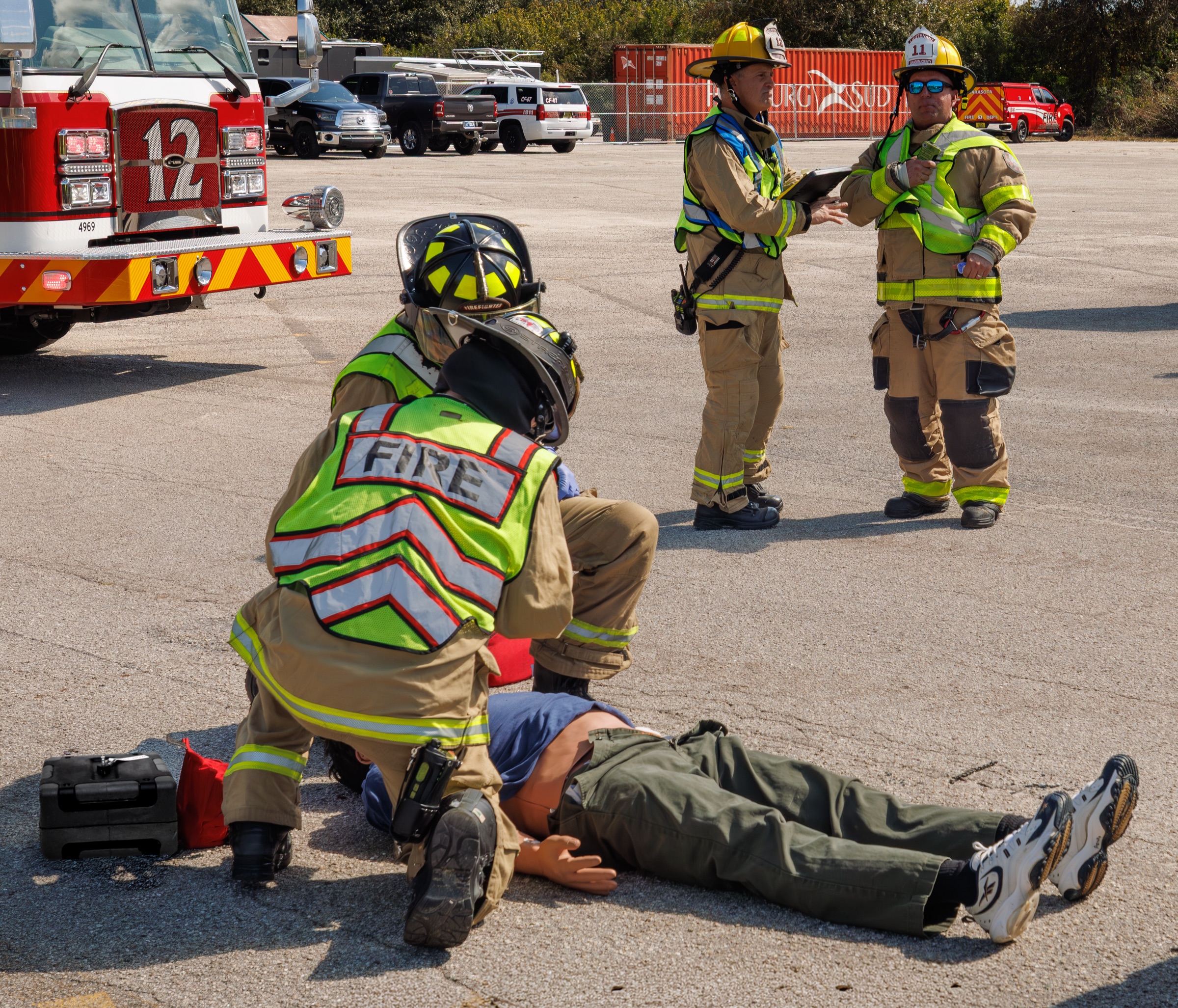 On-scene firefighter treating a patient during a training exercise
